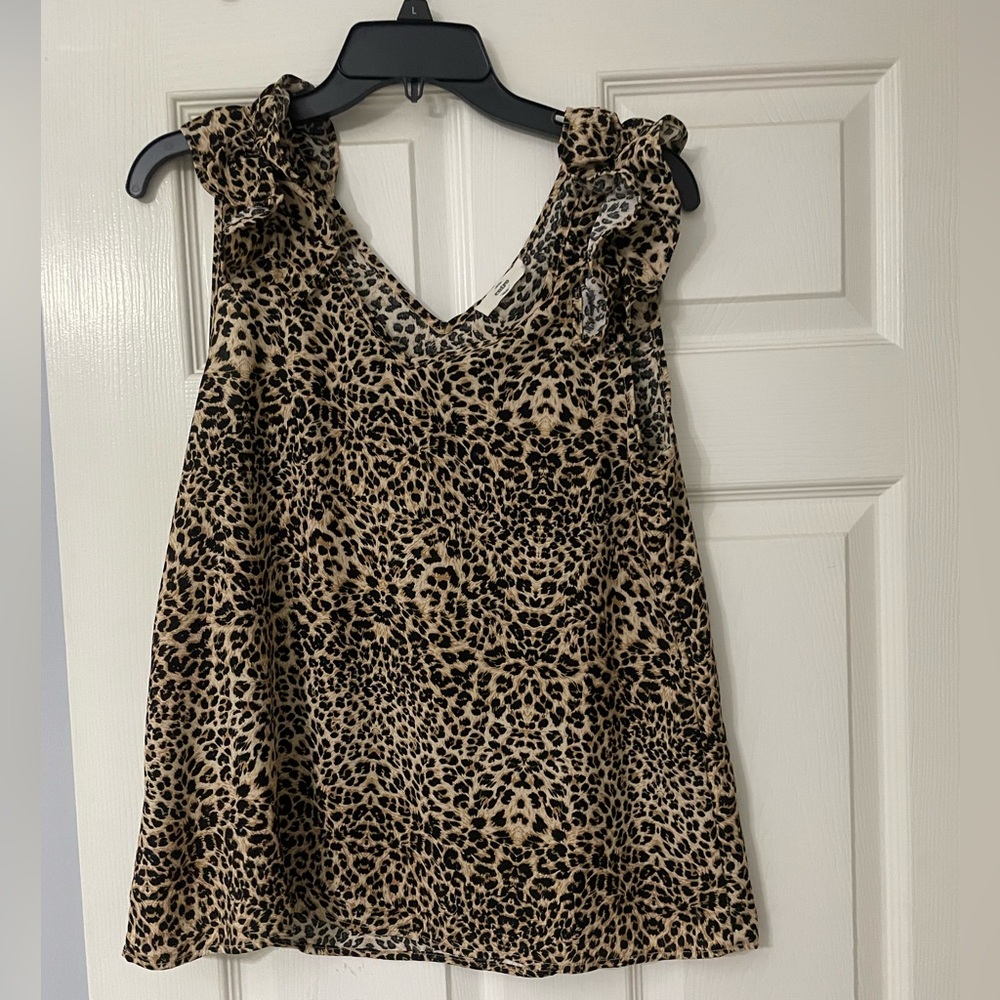 cheetah print tank top with ruffle detailing.